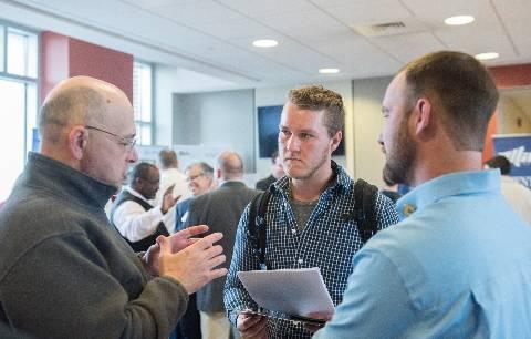 Discussion at a career fair on campus