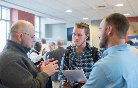 Career Fair Discussion Discussion at a career fair on campus