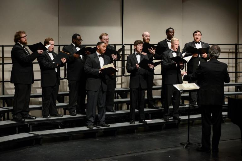 Men's chorus sings on a concert