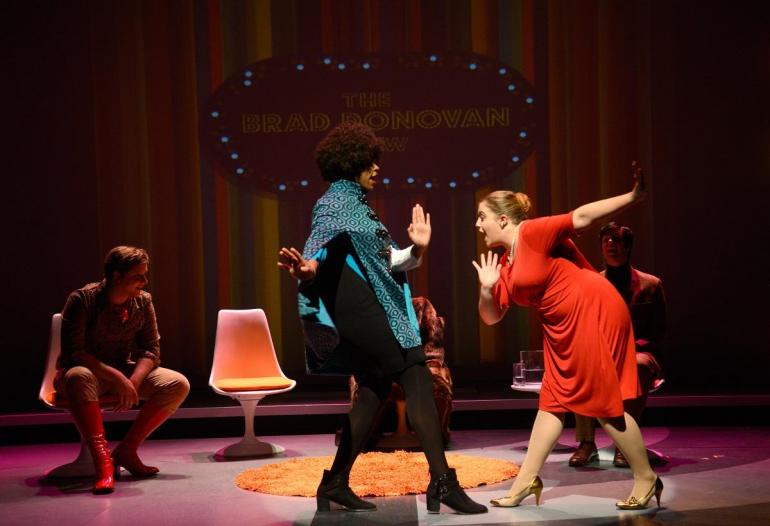 cast members dance on stage