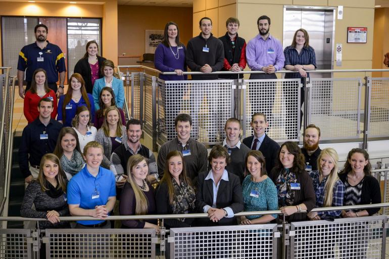 Group photo on stairs at 2014 PT Forum 