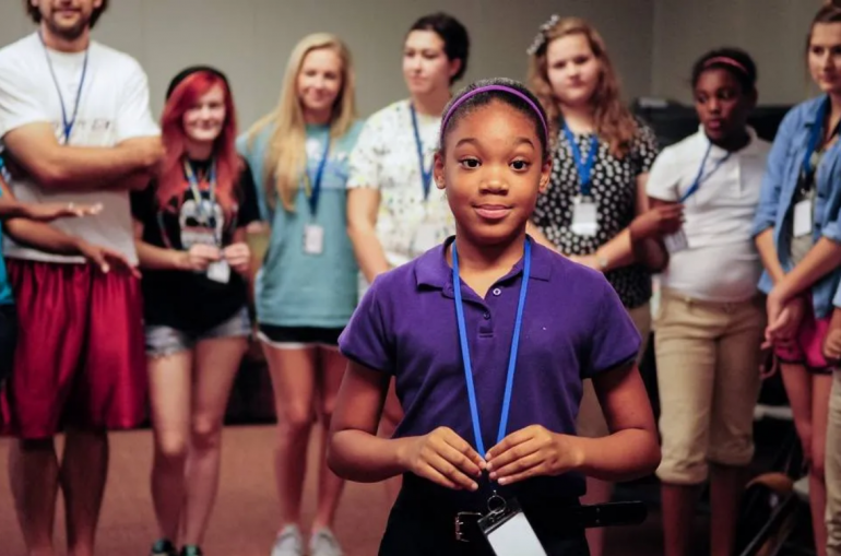 CK Now Purpose Student Stands in front of other students