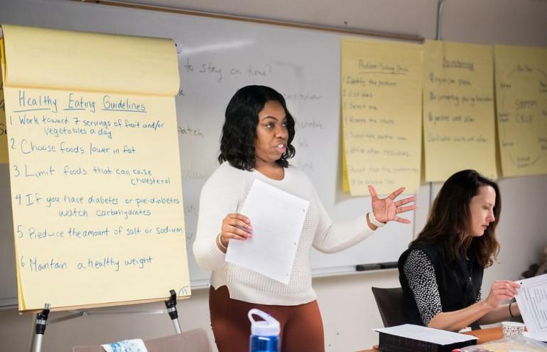Careers - Community Health Woman in front of classroom