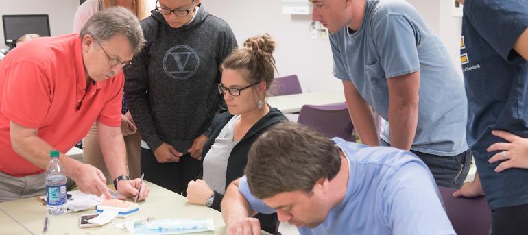 Group of people working on nursing stuff