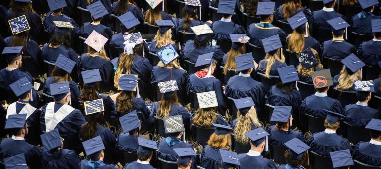 Overhead view of graduates and their hats