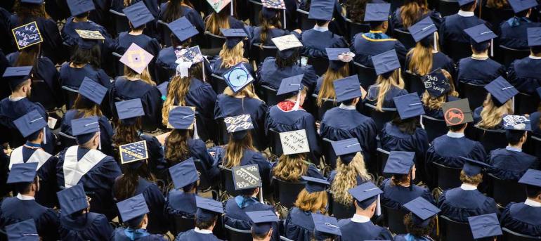 EOC Graduates Overhead view of graduates and their hats