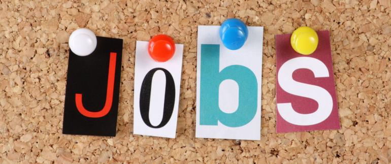 Jobs Jobs paper letters on cork board