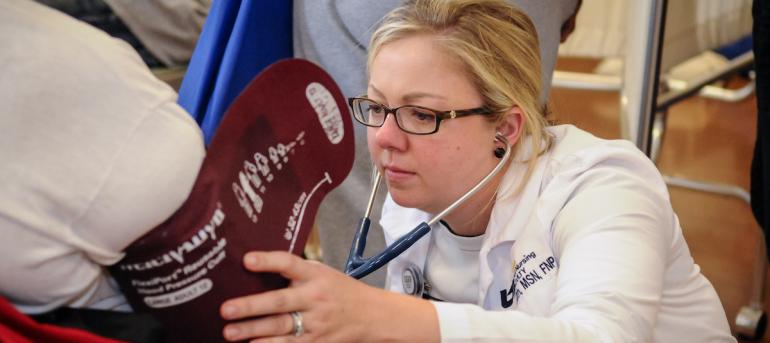 2014 nursing health fair blood pressure Nursing student takes blood pressure