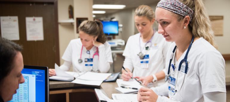 Students at desk in Nursing Clinicals 