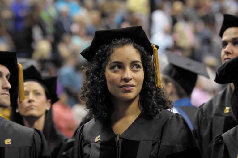 Female Student in a cap and gown