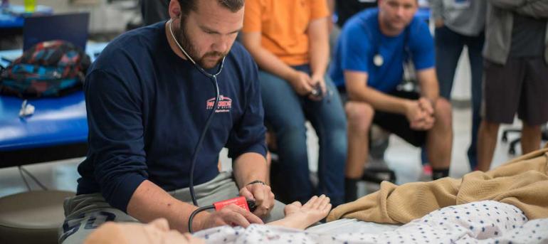 Student works with sim mannequin