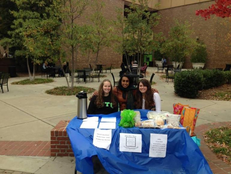 3 students sitting at a table