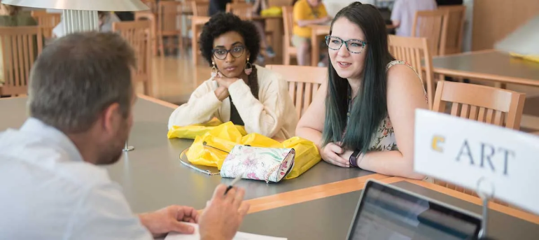 Students talking to an advisor