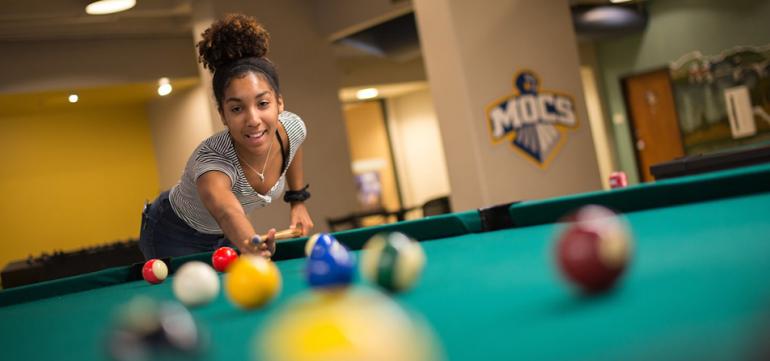 Student playing pool