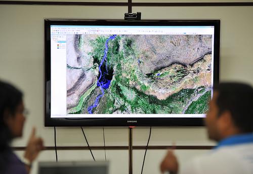 GIS staff at IWMI go through a satellite map