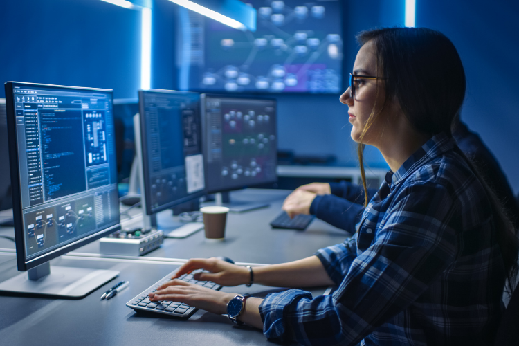IT Female Professional Working at Computer Stock Photo IT Female Professional Working at Computer Stock Photo