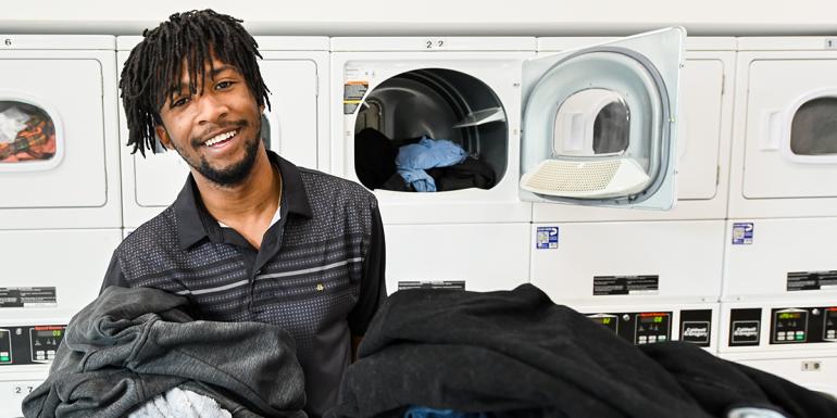 Student in Housing Laundry Room