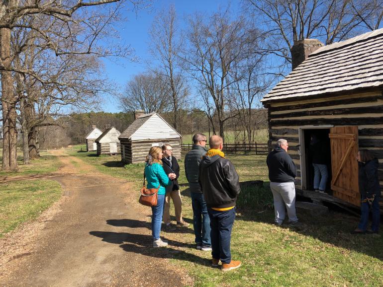Students looking at cabins