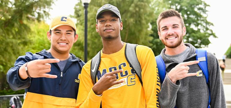 Three male students posing with Power C