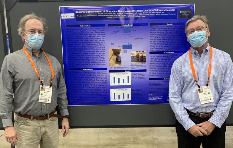 Drs. Spratt and Levine giving a Poster Presentation