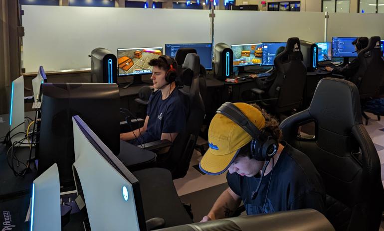 Students play video games on Alienware PCs inside the University Center Esports & Gaming Facility