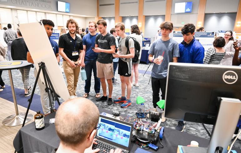 Students visiting the 2023 Spring Research  and Arts Conference