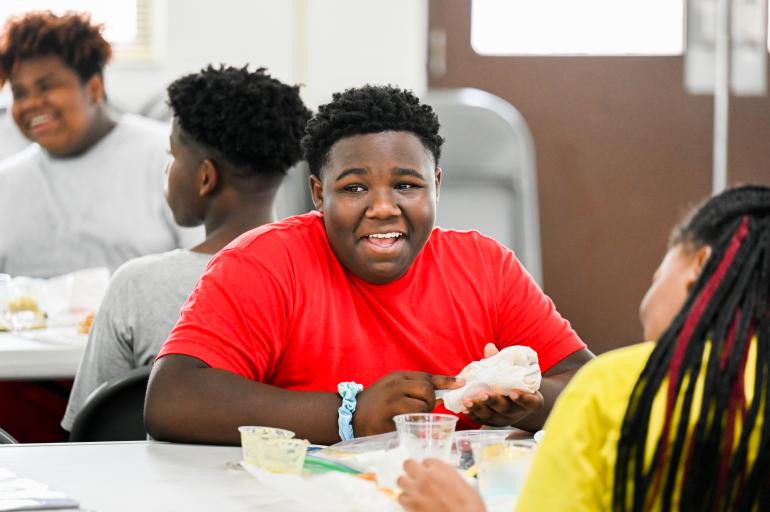 A student laughing while sitting