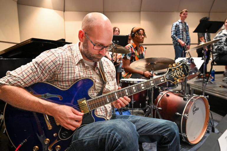 Photo of guitarist in UTC Jazz Band