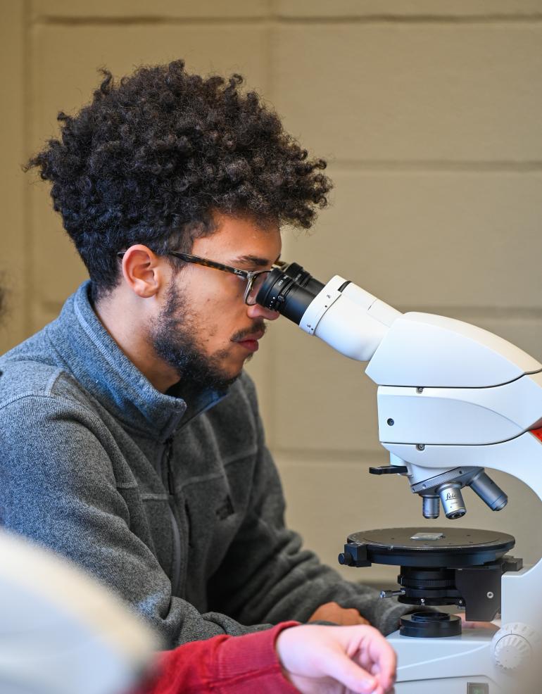 student and microscope