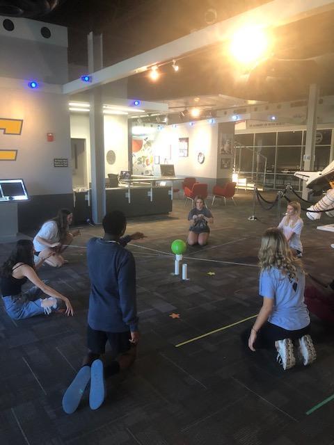 AdvanceU students participate in a team building activity at the Challenger Center