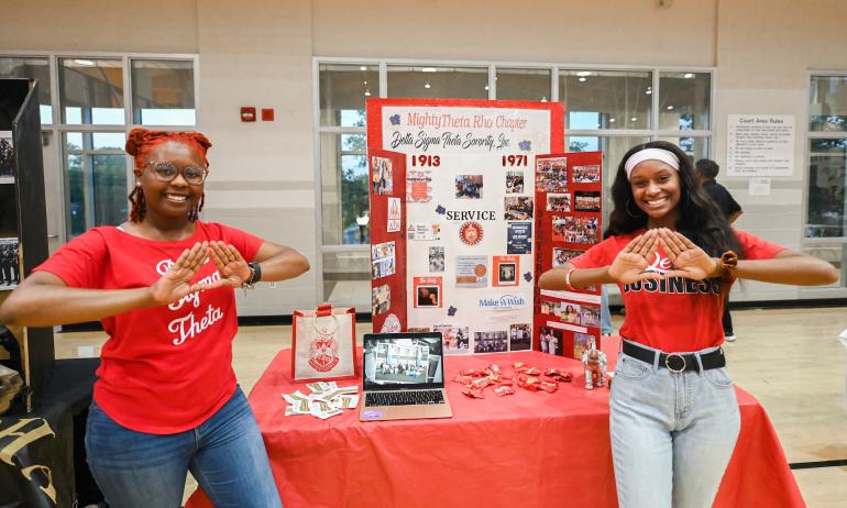 Two member of Delta Sigma Theta pose for a photo