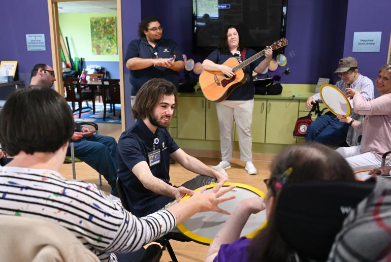 Photo of Music Therapy students playing guitar