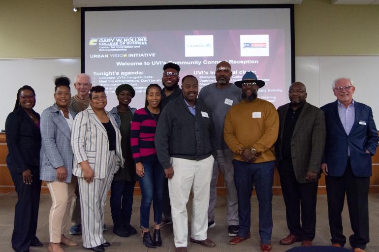 Graduates of the 2023 Urban Vision Initiative program stand with Mike Bradshaw and Bill McDonald during a Community Connect Celebration in the Chattanooga Small Business Development Center.