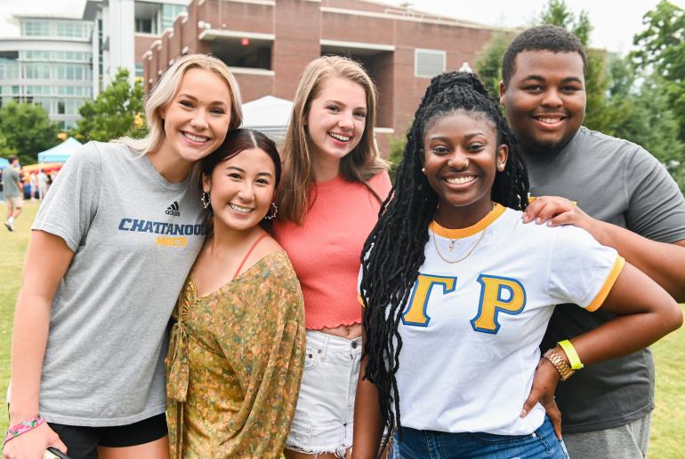 Students pose for photo at Oak Street Roast