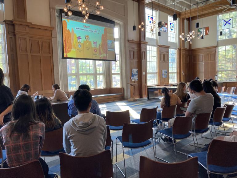 Group of People around projector