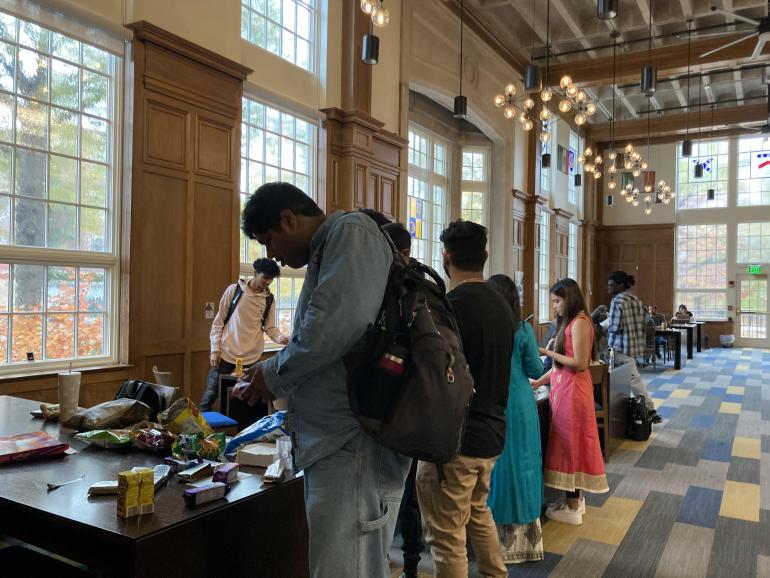 Students at an event table