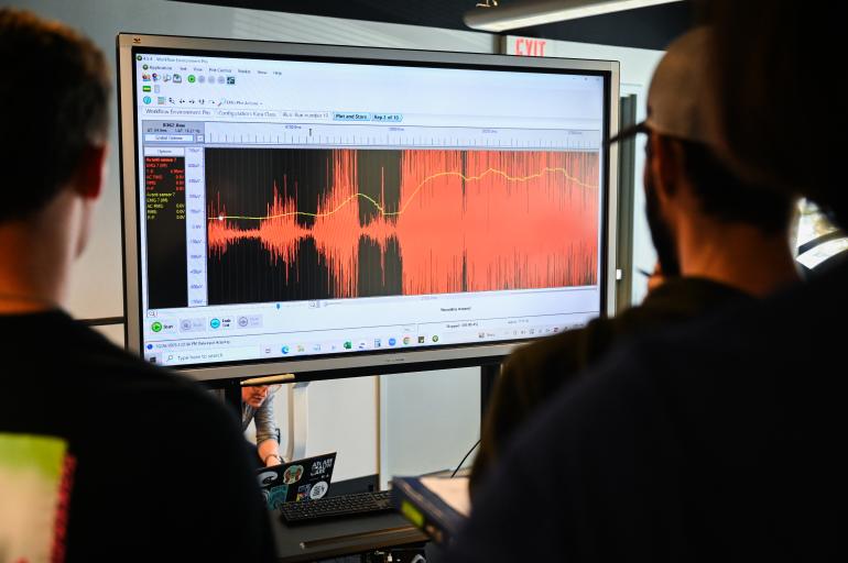 Students looking at a monitor