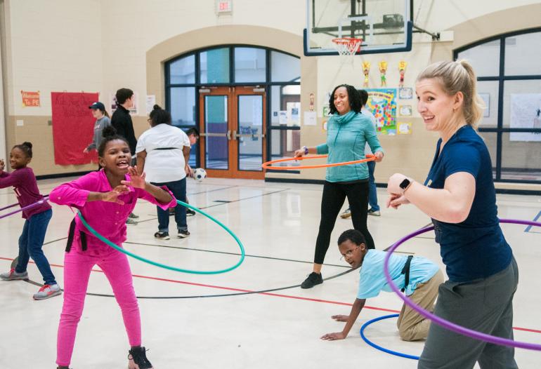 Kids using ring hoops