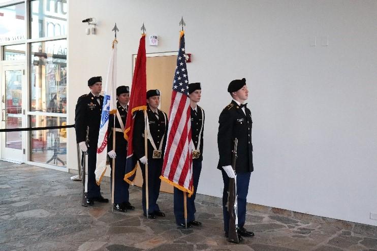 ROTC standing by flags