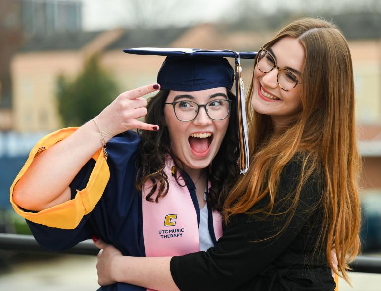 UTC music therapy student in graduation cap and gown