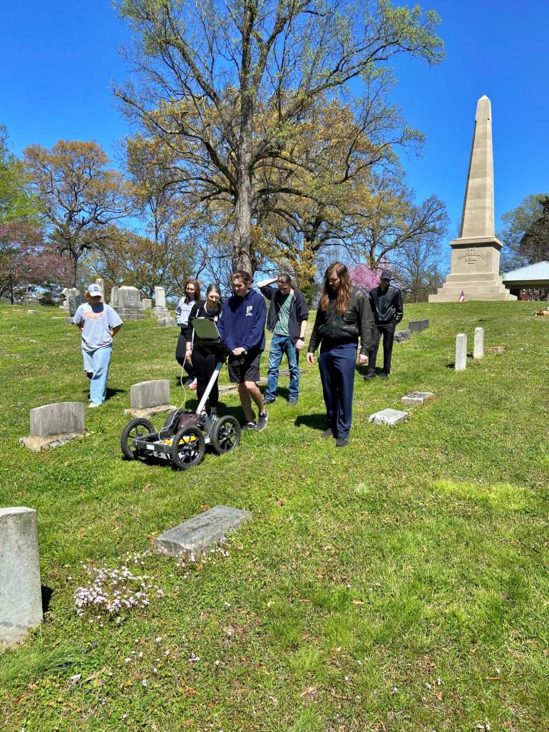 Students using a ground penetrating radar.