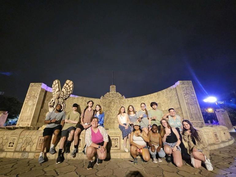 Students posing at rear of the Monumento a la Patria-Merida
