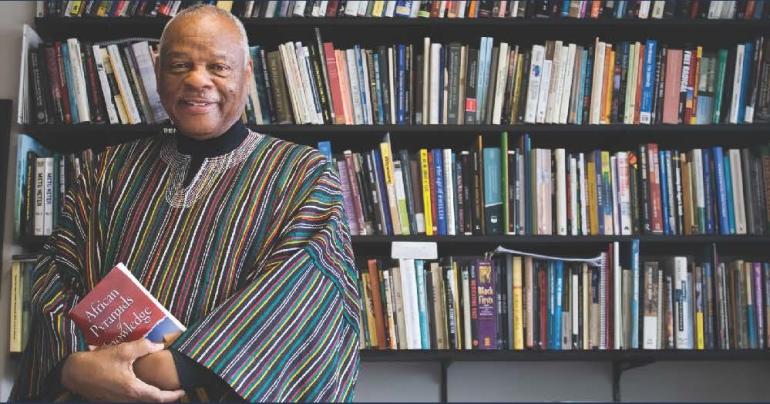  A picture of a man in front of a bookcase