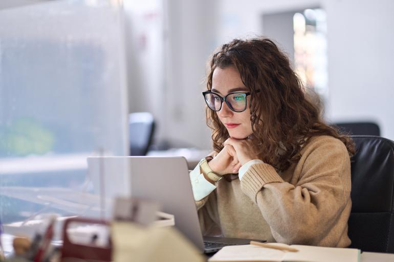 Woman completing her masters degree online