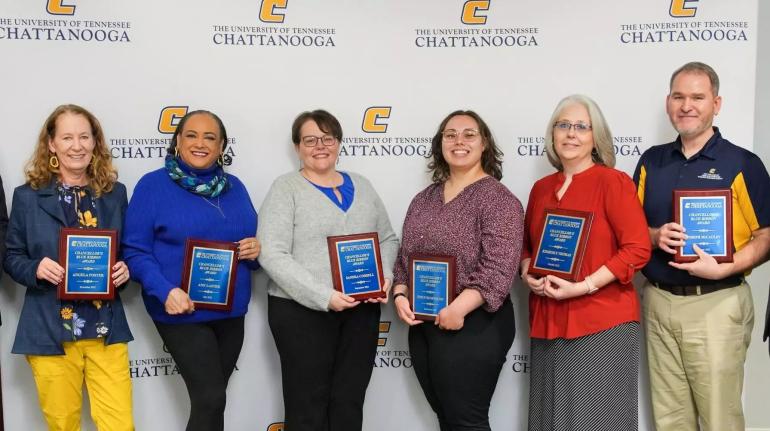 UTC blue ribbon awards UTC staff receiving their blue ribbon award plaques