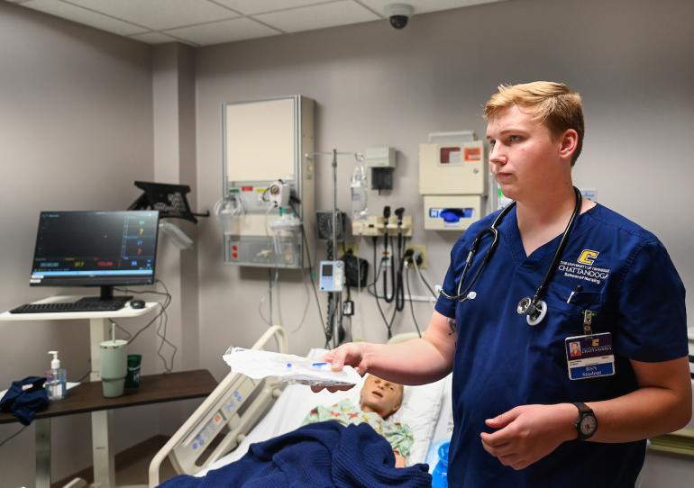 nursing student holding a chart