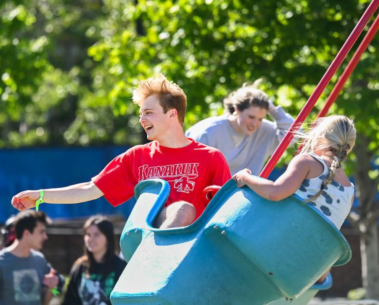 students riding in a carnival ride
