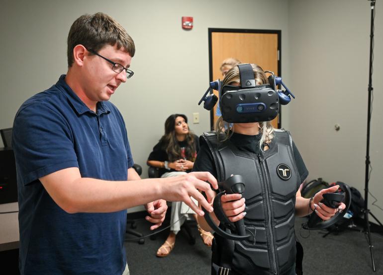 student using virtual reality equipment