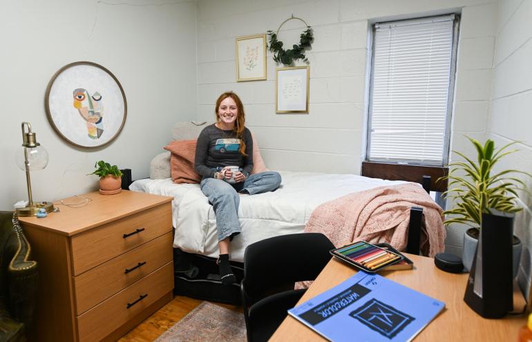Boling student on bed