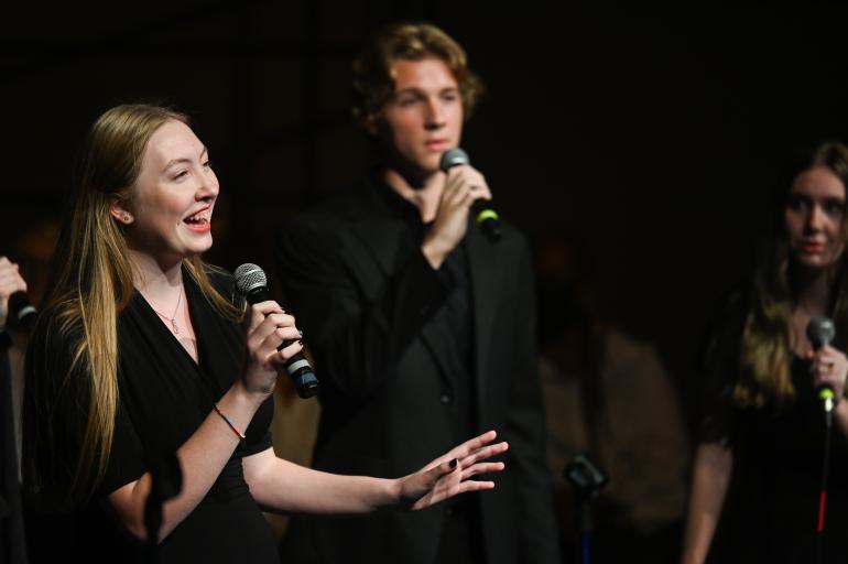 People singing with microphones